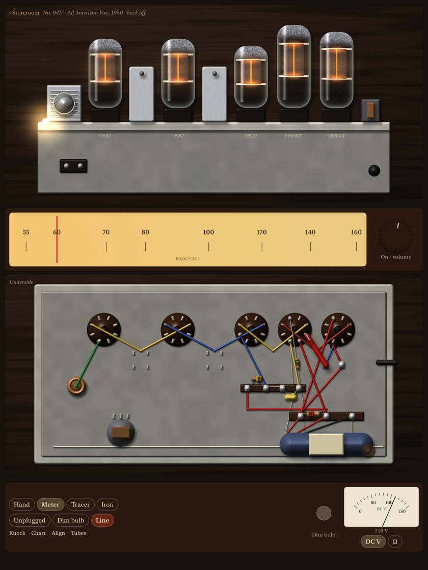 The bench: an All American Five from behind with its five tubes glowing orange, the dial below, the chassis turned over beside it with its point-to-point wiring, and the meter reading 110 volts on the output tube's plate
